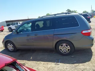 2007 Honda Odyssey EX-L z VIN 5FNRL38797B137595, wystawiony jako IAAI lot #42002233 z przebiegiem 192 296 mil mil oraz . Historia ofert i sprzedaży dostępna na DreamBid. Obrazek 14.