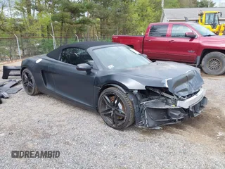 2015 Audi R8 z VIN WUASUAFG7FN000325, wystawiony jako IAAI lot #42052062 z przebiegiem 27 221 mil mil oraz . Historia ofert i sprzedaży dostępna na DreamBid. Obrazek 1.