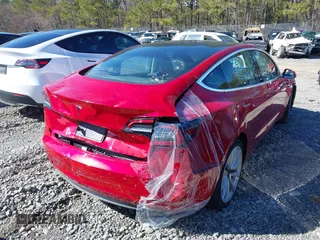 2020 Tesla Model 3 Standard Range Plus with VIN 5YJ3E1EA9LF708808, listed as a IAAI auction lot 40018323 with 32,069 mi miles. Bid and sale history available at carsss.com. Image 4.