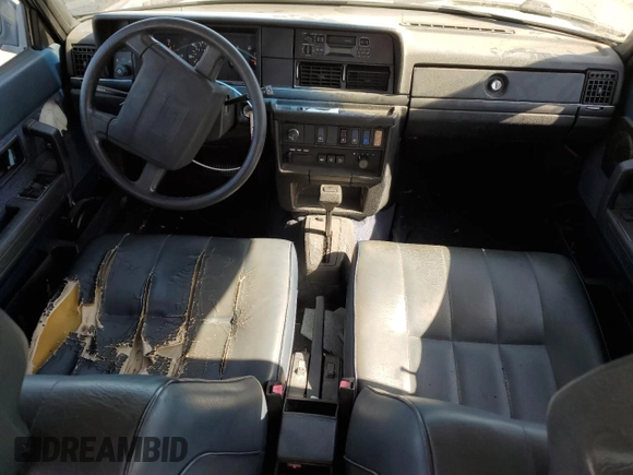 1993 Volvo 240 with VIN YV1AW8311P1955233, listed as a Copart auction lot 76514004 with 216,723 mi miles and Salvage title. Bid and sale history available at DreamBid. Image 8.
