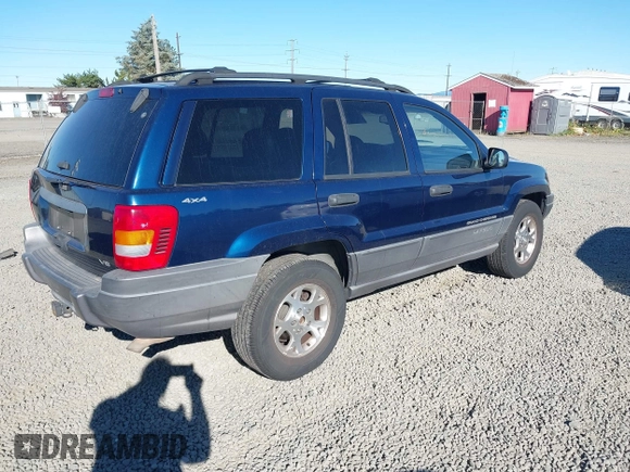 2001 Jeep Grand Cherokee Laredo with VIN 1J4GW48N31C727194, listed as a IAAI auction lot 42703915 with 176,896 mi miles and . Bid and sale history available at DreamBid. Image 4.