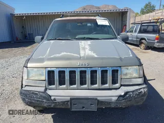 1997 Jeep Grand Cherokee Laredo with VIN 1J4GZ58S3VC603239, listed as a IAAI auction lot 42593915 with 295,696 mi miles and . Bid and sale history available at DreamBid. Image 6.
