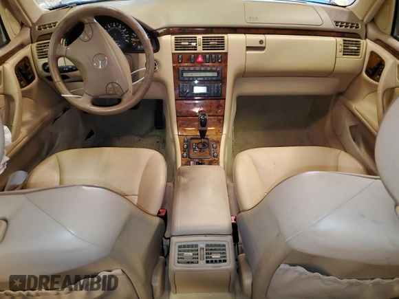 2002 Mercedes-Benz E-Class with VIN WDBJF65J12B485293, listed as a Copart auction lot 77561984 with 140,708 mi miles and Salvage Title. Bid and sale history available at carsss.com. Image 8.