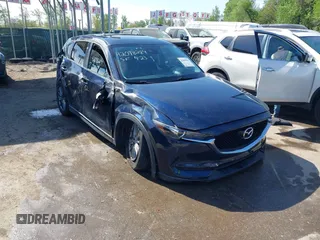 2017 Mazda CX-5 Touring z VIN JM3KFACL2H0198070, wystawiony jako IAAI lot #42098284 z przebiegiem 158 444 mil mil oraz . Historia ofert i sprzedaży dostępna na DreamBid. Obrazek 1.