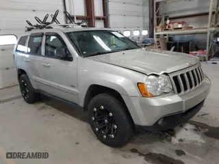 2010 Jeep Grand Cherokee Laredo with VIN 1J4PR4GK9AC160097, listed as a IAAI auction lot 41883264 with 240,409 mi miles. Bid and sale history available at carsss.com. Image 1.