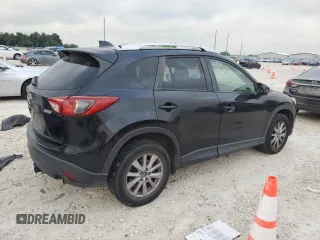 2015 Mazda CX-5 Touring with VIN JM3KE4CYXF0446370, listed as a Copart auction lot 52392575 with 132,419 mi miles and Salvage Title. Bid and sale history available at DreamBid. Image 3.