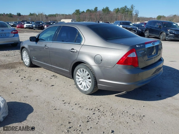 2011 Ford Fusion Hybrid with VIN 3FADP0L36BR114063, listed as a IAAI auction lot 42013961 with 141,255 mi miles. Bid and sale history available at carsss.com. Image 3.