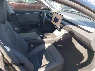 2024 Tesla Model 3 with VIN 5YJ3E1EA0RF718703, listed as a IAAI auction lot 41278243 with 6,504 mi miles. Bid and sale history available at carsss.com. Image 5.