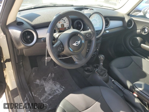 2013 MINI Hardtop with VIN WMWSU3C56DT682857, listed as a Copart auction lot 77677234 with 92,625 mi miles and Clean Title. Bid and sale history available at DreamBid. Image 8.