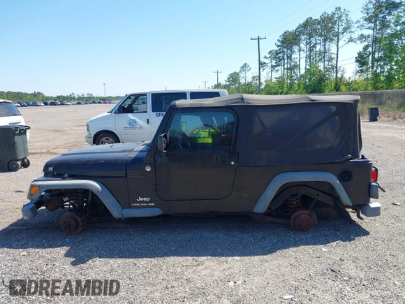 2005 Jeep Wrangler Unlimited with VIN 1J4FA44S25P385421, listed as a IAAI auction lot 42039381 with 1 mi miles. Bid and sale history available at carsss.com. Image 13.