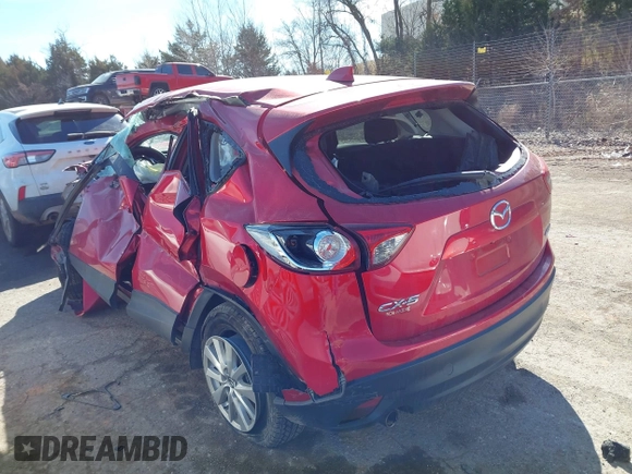 2014 Mazda CX-5 Touring z VIN JM3KE2CY2E0364488, wystawiony jako IAAI lot #41635188 z przebiegiem 127 688 mil mil oraz . Historia ofert i sprzedaży dostępna na DreamBid. Obrazek 3.