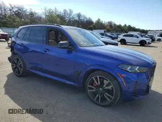 2024 BMW X5 M60i with VIN 5UX33EU07R9U78919, listed as a Copart auction lot 70676234 with 14,301 mi miles and Salvage Title. Bid and sale history available at carsss.com. Image 4.