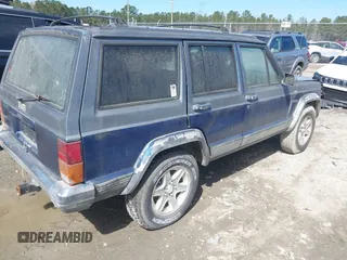 1996 Jeep Cherokee Country with VIN 1J4FT78S5TL148433, listed as a IAAI auction lot 41722054 with 276,612 mi miles and . Bid and sale history available at DreamBid. Image 4.