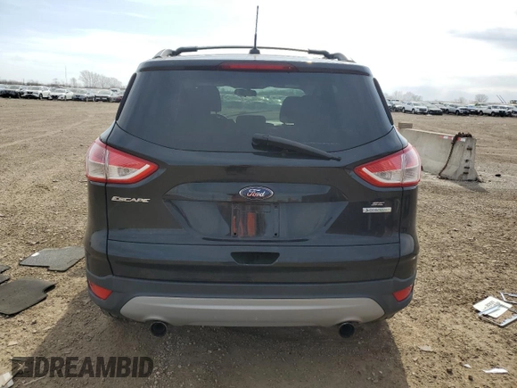 2013 Ford Escape SE z VIN 1FMCU0GX1DUA20580, wystawiony jako Copart lot #52644595 z przebiegiem 151 143 mil mil oraz Szkoda całkowita • Salvage title. Historia ofert i sprzedaży dostępna na DreamBid. Obrazek 6.