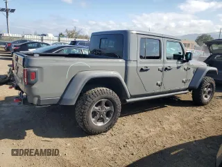 2023 Jeep Gladiator Rubicon with VIN 1C6JJTBG8PL550219, listed as a Copart auction lot 54627685 with 9,671 mi miles and Salvage title. Bid and sale history available at DreamBid. Image 3.