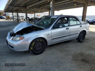 2002 Mazda Protege DX with VIN JM1BJ225120605237, listed as a Copart auction lot 49331225 with 184,556 mi miles and Salvage Title. Bid and sale history available at DreamBid. Image 1.