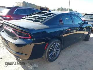2019 Dodge Charger SXT with VIN 2C3CDXJG4KH710673, listed as a IAAI auction lot 41469797 with 102,011 mi miles and . Bid and sale history available at DreamBid. Image 4.
