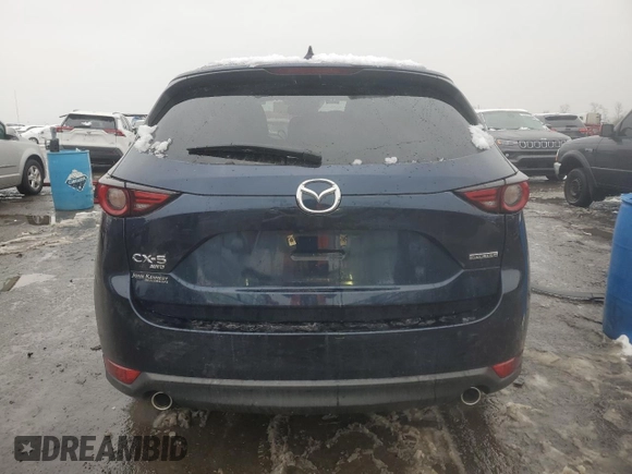 2021 Mazda CX-5 Grand Touring with VIN JM3KFBDM0M0391325, listed as a Copart auction lot 44863215 with 21,997 mi miles and Salvage Title. Bid and sale history available at DreamBid. Image 6.
