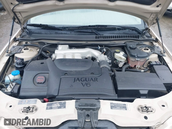 2003 Jaguar X-Type 2.5L Manual z VIN SAJEA51D53XC94089, wystawiony jako IAAI lot #42370566 z przebiegiem 81 687 mil mil oraz . Historia ofert i sprzedaży dostępna na DreamBid. Obrazek 10.