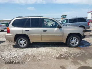 2005 GMC Envoy SLE with VIN 1GKDT13S252264932, listed as a IAAI auction lot 41981566 with 140,566 mi miles. Bid and sale history available at carsss.com. Image 14.