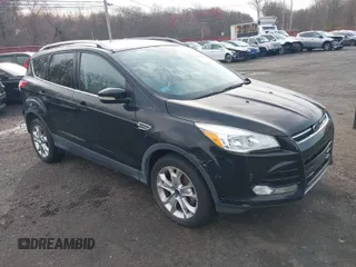 2014 Ford Escape Titanium with VIN 1FMCU9J98EUD73818, listed as a IAAI auction lot 42036442 with 129,794 mi miles. Bid and sale history available at carsss.com. Image 1.