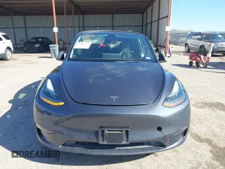 2023 Tesla Model Y Long Range with VIN 7SAYGAEE8PF667728, listed as a IAAI auction lot 41839771 with 32,654 mi miles and . Bid and sale history available at DreamBid. Image 12.