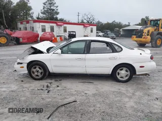1999 Ford Taurus SE with VIN 1FAFP53S4XA185115, listed as a IAAI auction lot 41263216 with 182,770 mi miles. Bid and sale history available at carsss.com. Image 14.
