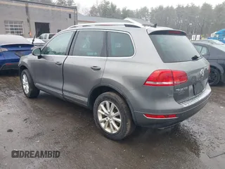 2013 Volkswagen Touareg Lux with VIN WVGEF9BP7DD007170, listed as a IAAI auction lot 41787075 with 131,089 mi miles and . Bid and sale history available at DreamBid. Image 3.