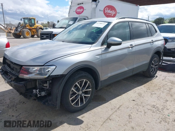 2021 Volkswagen Tiguan S with VIN 3VV1B7AX1MM070775, listed as a IAAI auction lot 41788112 with 22,107 mi miles and . Bid and sale history available at DreamBid. Image 2.