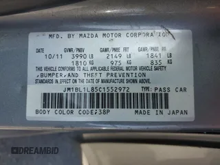 2012 Mazda 3 i Touring z VIN JM1BL1L85C1552972, wystawiony jako Copart lot #60358845 z przebiegiem 293 715 mil mil oraz Czysty tytuł • Clean title. Historia ofert i sprzedaży dostępna na DreamBid. Obrazek 14.