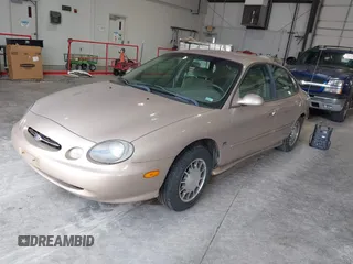 1999 Ford Taurus SE Comfort z VIN 1FAFP53S0XG145837, wystawiony jako IAAI lot #42384370 z przebiegiem 94 870 mil mil oraz . Historia ofert i sprzedaży dostępna na DreamBid. Obrazek 2.