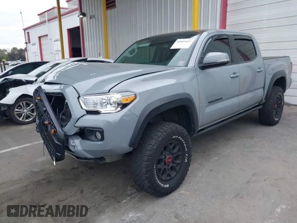 2021 Toyota Tacoma SR z VIN 5TFCZ5AN5MX281428, wystawiony jako IAAI lot #41893437 z przebiegiem 36 204 mil mil oraz . Historia ofert i sprzedaży dostępna na DreamBid. Obrazek 17.