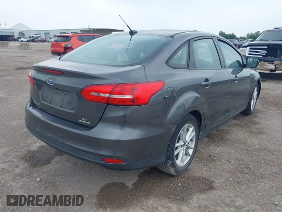 2017 Ford Focus SE z VIN 1FADP3F21HL205009, wystawiony jako IAAI lot #42305641 z przebiegiem 75 160 mil mil oraz . Historia ofert i sprzedaży dostępna na DreamBid. Obrazek 4.