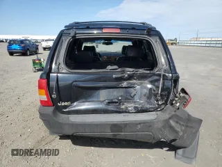 1999 Jeep Grand Cherokee Limited with VIN 1J4GW68N4XC679841, listed as a Copart auction lot 59760015 with 155,366 mi miles and Salvage title. Bid and sale history available at DreamBid. Image 6.