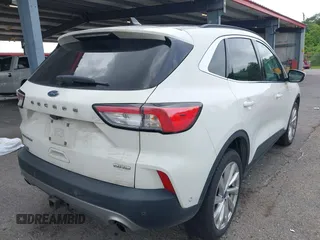2021 Ford Escape Titanium with VIN 1FMCU9J93MUA36648, listed as a IAAI auction lot 42055229 with 122,864 mi miles and . Bid and sale history available at carsss.com. Image 4.