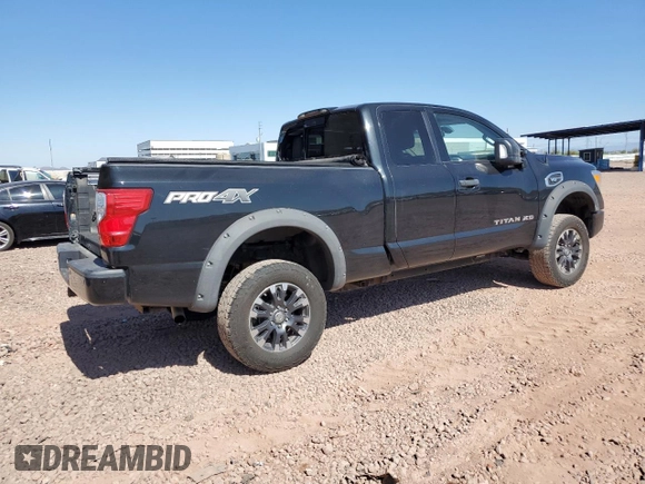 2018 Nissan Titan with VIN 1N6AA1C43JN549358, listed as a Copart auction lot 62417435 with 125,394 mi miles and Salvage title. Bid and sale history available at DreamBid. Image 3.