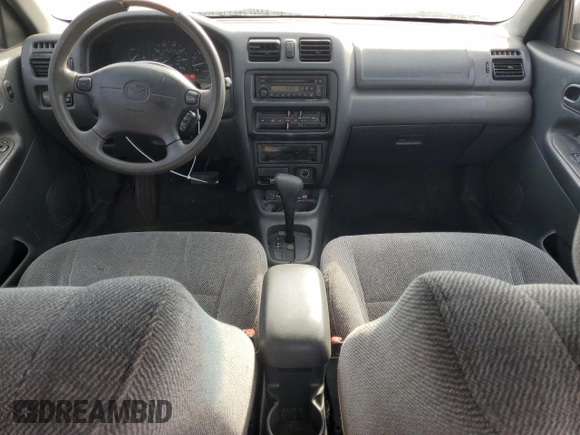 1998 Mazda Protege DX z VIN JM1BC1416W0194406, wystawiony jako Copart lot #44535955 z przebiegiem 312 942 mil mil oraz Szkoda całkowita • Salvage title. Historia ofert i sprzedaży dostępna na DreamBid. Obrazek 8.