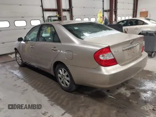2003 Toyota Camry LE with VIN 4T1BE32K73U136399, listed as a IAAI auction lot 41877554 with 235,078 mi miles and . Bid and sale history available at DreamBid. Image 3.