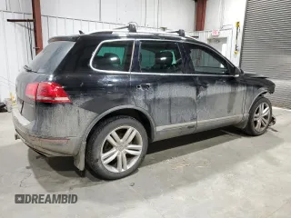 2011 Volkswagen Touareg Exec with VIN WVGFK9BP6BD006430, listed as a Copart auction lot 84288014 with 186,189 mi miles and Salvage Title. Bid and sale history available at DreamBid. Image 3.