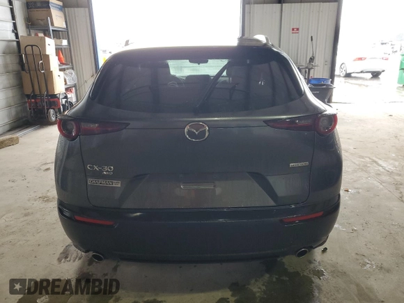 2023 Mazda CX-30 S Carbon Edition z VIN 3MVDMBCM5PM569903, wystawiony jako Copart lot #84850594 z przebiegiem 14 653 mil mil oraz Szkoda całkowita • Salvage title. Historia ofert i sprzedaży dostępna na DreamBid. Obrazek 6.