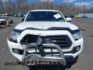 2020 Toyota Tacoma SR5 with VIN 3TMCZ5AN5LM339977, listed as a IAAI auction lot 41886937 with 94,986 mi miles and . Bid and sale history available at DreamBid. Image 6.