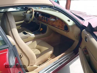 1997 Jaguar XK with VIN SAJGX274XVC004952, listed as a IAAI auction lot 42211023 with 109,889 mi miles and . Bid and sale history available at DreamBid. Image 5.