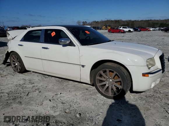 2006 Chrysler 300 C with VIN 2C3KA63H56H477106, listed as a Copart auction lot 48004705 with 174,593 mi miles and Salvage Title. Bid and sale history available at carsss.com. Image 4.