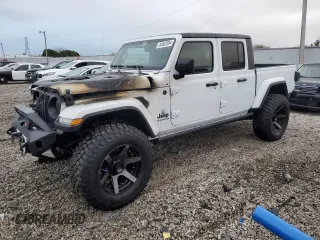 2022 Jeep Gladiator Sport S z VIN 1C6JJTAG1NL148203, wystawiony jako Copart lot #46662015 z przebiegiem 1 900 mil mil oraz Nie do naprawy • Non repairable. Historia ofert i sprzedaży dostępna na DreamBid. Obrazek 1.