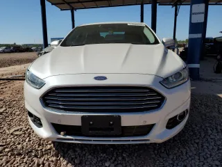 2013 Ford Fusion Titanium Hybrid z VIN 3FA6P0RUXDR376633, wystawiony jako Copart lot #57685555 z przebiegiem 133 248 mil mil oraz Szkoda całkowita • Salvage title. Historia ofert i sprzedaży dostępna na DreamBid. Obrazek 5.