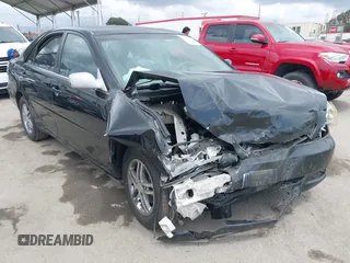 2002 Toyota Camry LE z VIN JTDBE32K020049423, wystawiony jako IAAI lot #42130898 z przebiegiem 165 265 mil mil oraz . Historia ofert i sprzedaży dostępna na DreamBid. Obrazek 1.