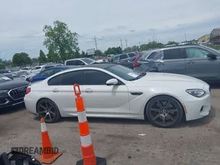 2015 BMW M6 z VIN WBS6C9C50FD467538, wystawiony jako IAAI lot #42366043 z przebiegiem 66 379 mil mil oraz . Historia ofert i sprzedaży dostępna na DreamBid. Obrazek 13.