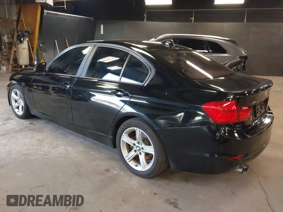 2014 BMW 3 Series 328i xDrive with VIN WBA3B3G50ENR83599, listed as a IAAI auction lot 42106340 with 195,309 mi miles. Bid and sale history available at carsss.com. Image 3.