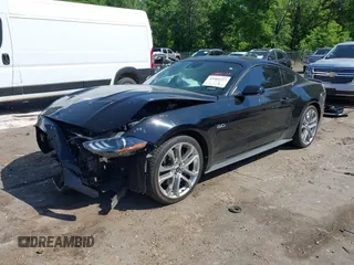 2021 Ford Mustang GT z VIN 1FA6P8CFXM5156002, wystawiony jako IAAI lot #42009222 z przebiegiem 65 939 mil mil oraz . Historia ofert i sprzedaży dostępna na DreamBid. Obrazek 2.