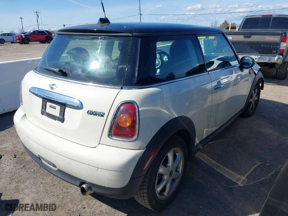2010 MINI Cooper Hardtop with VIN WMWMF3C59ATZ64568, listed as a IAAI auction lot 41809519 with 104,923 mi miles. Bid and sale history available at carsss.com. Image 4.